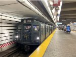 Arnine Car # 1802 leads a midday Holiday Train into 72nd Street Station on the Q Line